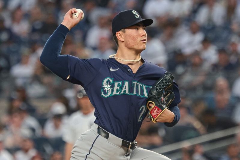 May 21, 2024; Bronx, New York, USA; Seattle Mariners starting pitcher Bryan Woo (22) delivers a pitch during the fourth inning against the New York Yankees  at Yankee Stadium. Mandatory Credit: Vincent Carchietta-USA TODAY Sports