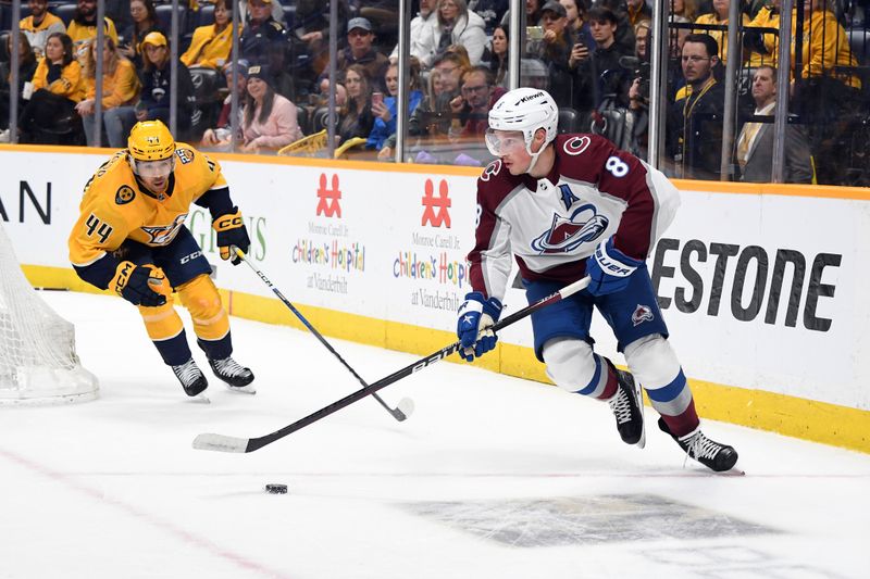 Mar 2, 2024; Nashville, Tennessee, USA; Colorado Avalanche defenseman Cale Makar (8) skates away from pressure by Nashville Predators left wing Kiefer Sherwood (44) during the first period at Bridgestone Arena. Mandatory Credit: Christopher Hanewinckel-USA TODAY Sports