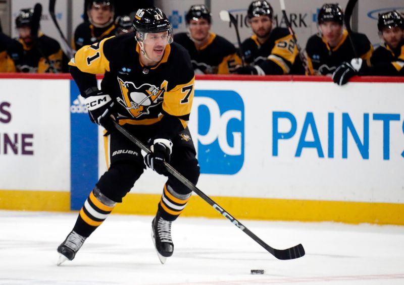 Mar 16, 2024; Pittsburgh, Pennsylvania, USA;  Pittsburgh Penguins center Evgeni Malkin (71) skates up ice with the puck against the New York Rangers during the first period at PPG Paints Arena. Mandatory Credit: Charles LeClaire-USA TODAY Sports