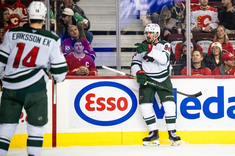 Nov 23, 2024; Calgary, Alberta, CAN; Minnesota Wild left wing Marcus Johansson (90) celebrates after scoring a goal against the Calgary Flames during the first period at Scotiabank Saddledome. Mandatory Credit: Brett Holmes-Imagn Images