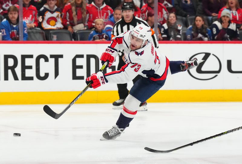 Jan 24, 2023; Denver, Colorado, USA;  Washington Capitals left wing Conor Sheary (73) shoots the puck in the first period against the Colorado Avalanche at Ball Arena. Mandatory Credit: Ron Chenoy-USA TODAY Sports