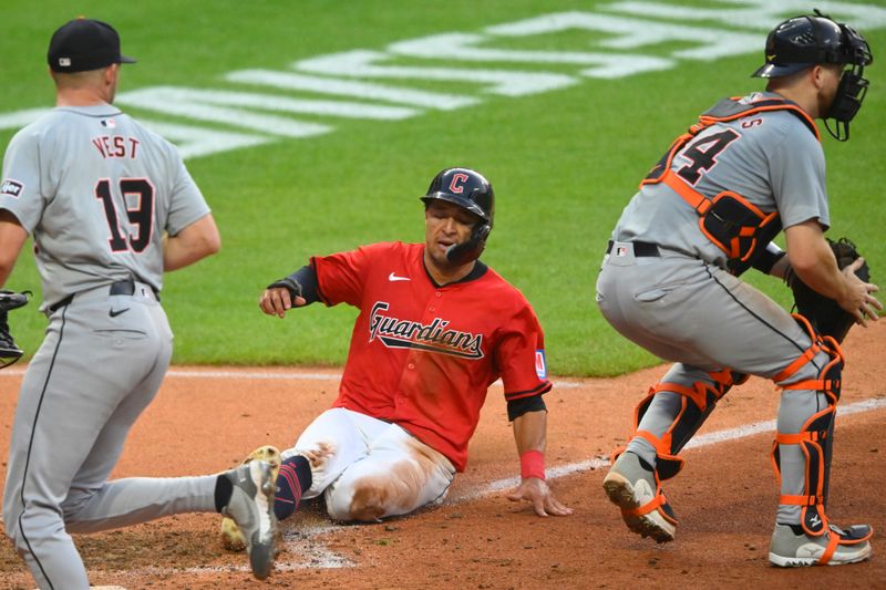 Jul 23, 2024; Cleveland, Ohio, USA; Cleveland Guardians center fielder Tyler Freeman (2) scores between Detroit Tigers relief pitcher Will Vest (19) and catcher Jake Rogers (34) in the sixth inning at Progressive Field. Mandatory Credit: David Richard-USA TODAY Sports