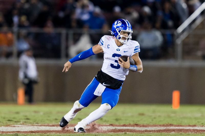 Nov 26, 2022; Stanford, California, USA;  Brigham Young Cougars quarterback Jaren Hall (3) runs the ball against the Stanford Cardinal during the second half at Stanford Stadium. Mandatory Credit: John Hefti-USA TODAY Sports