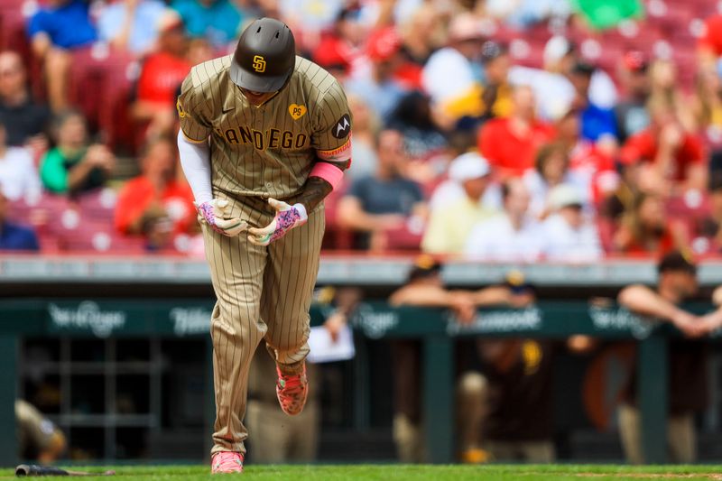 May 23, 2024; Cincinnati, Ohio, USA; San Diego Padres third baseman Manny Machado (13) reacts after a play in the eighth inning against the Cincinnati Reds at Great American Ball Park. Mandatory Credit: Katie Stratman-USA TODAY Sports