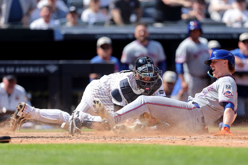 May 17, 2025; Bronx, New York, USA; New York Yankees catcher J.C. Escarra (25) tags out New York Mets third baseman Brett Baty (7) trying to score on a double by Mets center fielder Tyrone Taylor (not pictured) during the seventh inning at Yankee Stadium. Mandatory Credit: Brad Penner-Imagn Images
