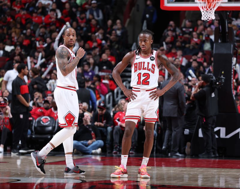 CHICAGO, IL - MARCH 18:  DeMar DeRozan #11 Ayo Dosunmu #12 of the Chicago Bulls looks on during the game against the of the Portland Trail Blazers on March 18, 2024 at United Center in Chicago, Illinois. NOTE TO USER: User expressly acknowledges and agrees that, by downloading and or using this photograph, User is consenting to the terms and conditions of the Getty Images License Agreement. Mandatory Copyright Notice: Copyright 2024 NBAE (Photo by Jeff Haynes/NBAE via Getty Images)