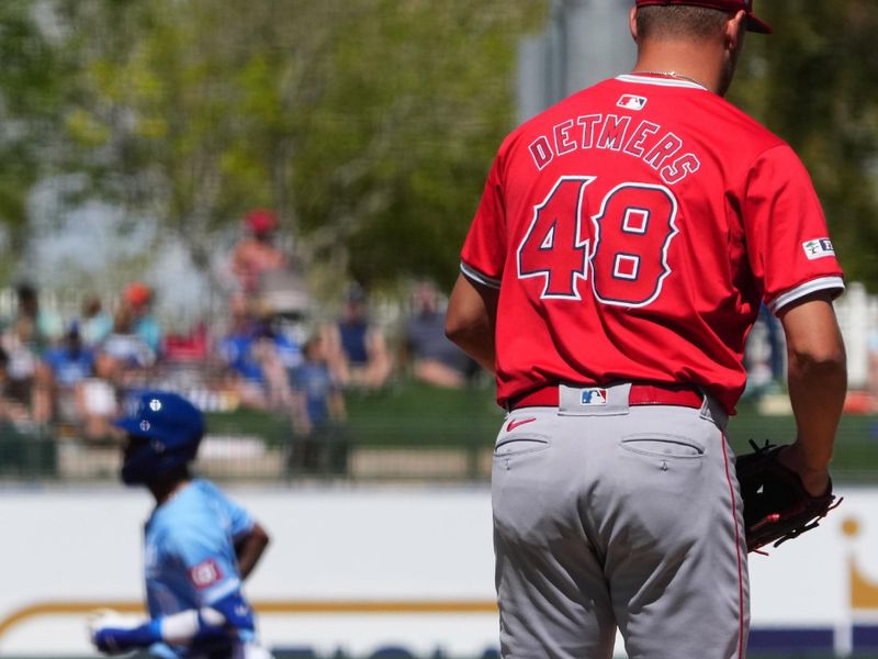 Mar 13, 2024; Surprise, Arizona, USA; Los Angeles Angels starting pitcher Reid Detmers (48) reacts after allowing a home run to Kansas City Royals third baseman Maikel Garcia (11) during the first inning at Surprise Stadium. Mandatory Credit: Joe Camporeale-USA TODAY Sports