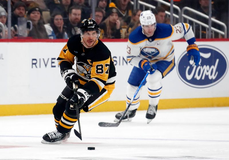 Jan 6, 2024; Pittsburgh, Pennsylvania, USA;  Pittsburgh Penguins center Sidney Crosby (87) skates up ice with the puck against the Buffalo Sabres during the first period at PPG Paints Arena. Mandatory Credit: Charles LeClaire-USA TODAY Sports