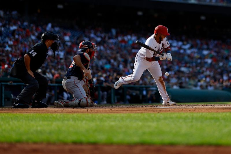 Aug 17, 2023; Washington, District of Columbia, USA; Washington Nationals catcher Keibert Ruiz (20) is hit by a pitch against the Boston Red Sox during the third inning at Nationals Park. Mandatory Credit: Geoff Burke-USA TODAY Sports