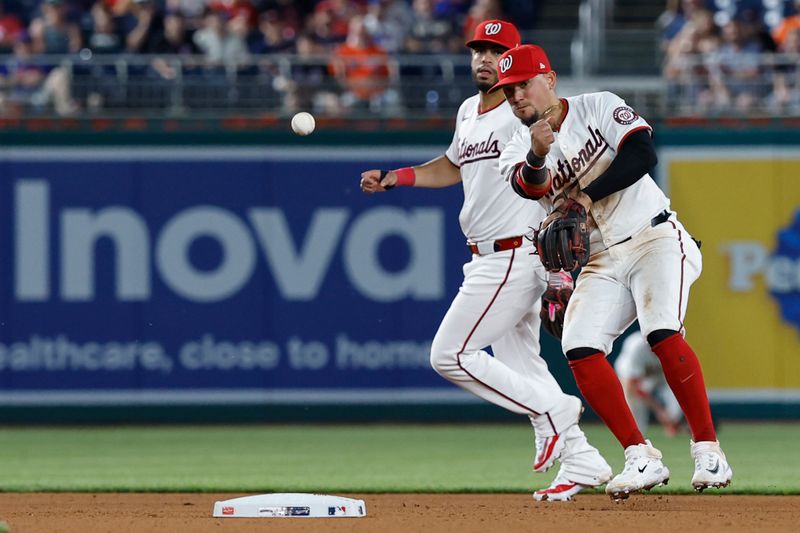 Jun 3, 2024; Washington, District of Columbia, USA; Washington Nationals second base Ildemaro Vargas (14) makes a throw to first base on a ground ball by New York Mets outfielder Harrison Bader (not pictured) during the seventh inning at Nationals Park. Mandatory Credit: Geoff Burke-USA TODAY Sports