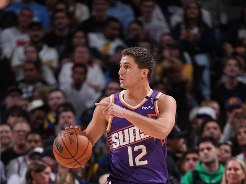 DENVER, CO - OCTOBER 13: Collin Gillespie #12 of the Phoenix Suns dribbles the ball during the game against the Denver Nuggets on October 13, 2024 at Ball Arena in Denver, Colorado. NOTE TO USER: User expressly acknowledges and agrees that, by downloading and/or using this Photograph, user is consenting to the terms and conditions of the Getty Images License Agreement. Mandatory Copyright Notice: Copyright 2024 NBAE (Photo by Garrett Ellwood/NBAE via Getty Images)