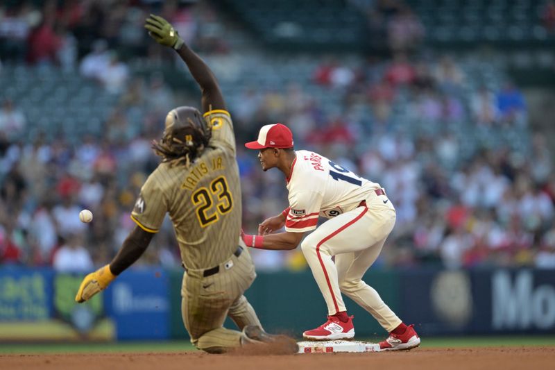 Jun 5, 2024; Anaheim, California, USA;  Los Angeles Angels second baseman Kyren Paris (19) takes the throw as San Diego Padres right fielder Fernando Tatis Jr. (23) is out at second in the third inning at Angel Stadium. Mandatory Credit: Jayne Kamin-Oncea-USA TODAY Sports