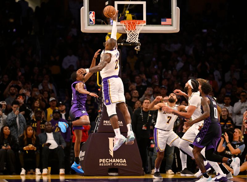 LOS ANGELES, CALIFORNIA - OCTOBER 26: Keegan Murray #13 of the Sacramento Kings looks up as LeBron James #23 of the Los Angeles Lakers blocks a shot, but is called for goal tending in the second half at Crypto.com Arena on October 26, 2024 in Los Angeles, California. NOTE TO USER: User expressly acknowledges and agrees that, by downloading and or using this photograph, User is consenting to the terms and conditions of the Getty Images License Agreement. (Photo by John McCoy/Getty Images)