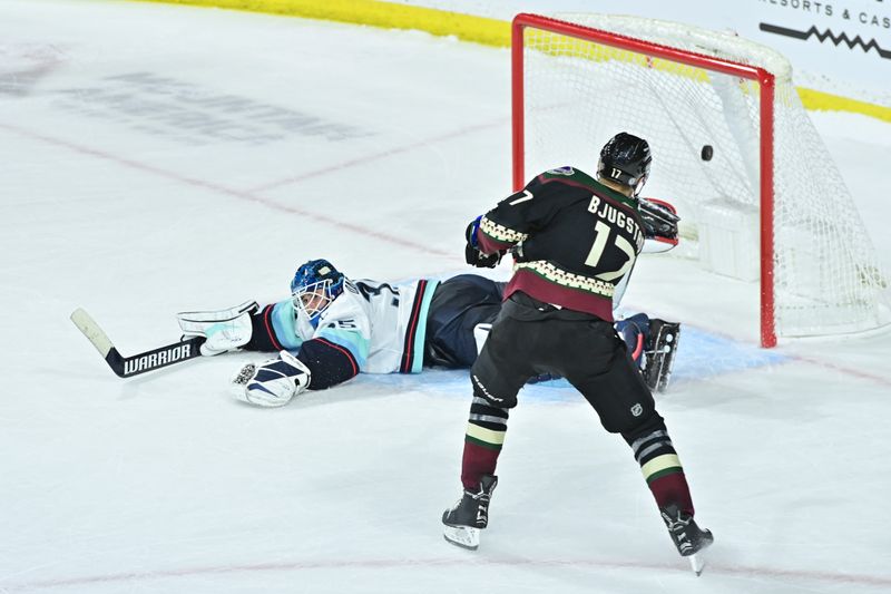 Nov 7, 2023; Tempe, Arizona, USA; Arizona Coyotes center Nick Bjugstad (17) scores on Seattle Kraken goaltender Joey Daccord (35) in the shootout  at Mullett Arena. Mandatory Credit: Matt Kartozian-USA TODAY Sports