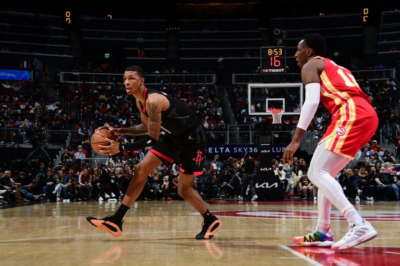 ATLANTA, GA - FEBRUARY 10: Jabari Smith Jr. #10 of the Houston Rockets dribbles the ball during the game against the Atlanta Hawks on February 10, 2024 at State Farm Arena in Atlanta, Georgia.  NOTE TO USER: User expressly acknowledges and agrees that, by downloading and/or using this Photograph, user is consenting to the terms and conditions of the Getty Images License Agreement. Mandatory Copyright Notice: Copyright 2024 NBAE (Photo by Scott Cunningham/NBAE via Getty Images)