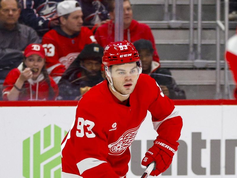 Mar 19, 2024; Detroit, Michigan, USA; Detroit Red Wings right wing Alex DeBrincat (93) handles the puck during the first period of the game against the Columbus Blue Jackets at Little Caesars Arena. Mandatory Credit: Brian Bradshaw Sevald-USA TODAY Sports