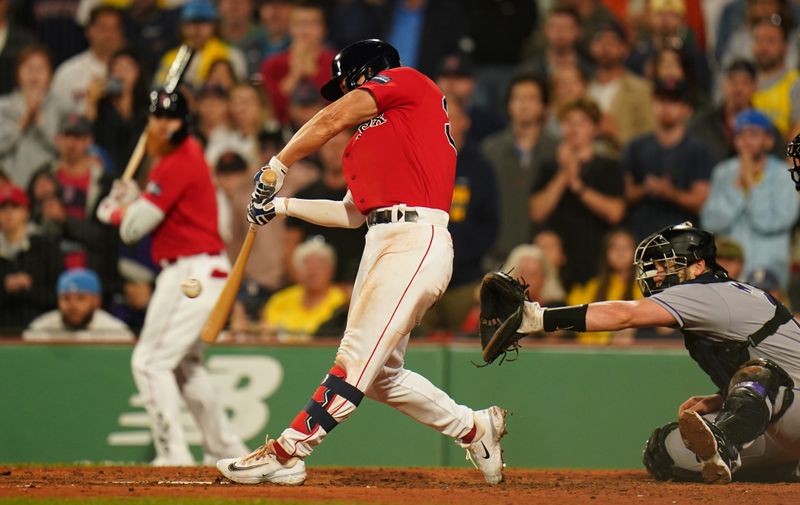 Jun 14, 2023; Boston, Massachusetts, USA; Boston Red Sox left fielder Rob Refsnyder (30) hits a triple to center field to drive in two runs against the Colorado Rockies in the seventh inning at Fenway Park. Mandatory Credit: David Butler II-USA TODAY Sports