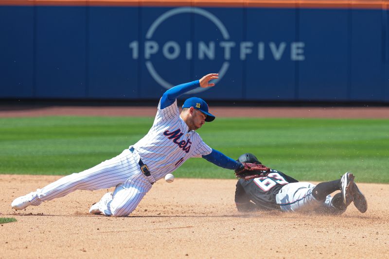 Aug 18, 2024; New York City, New York, USA; Miami Marlins shortstop Xavier Edwards (63) steals second base in front of New York Mets second baseman Jose Iglesias (11) during the eighth inning at Citi Field. Mandatory Credit: Vincent Carchietta-USA TODAY Sports