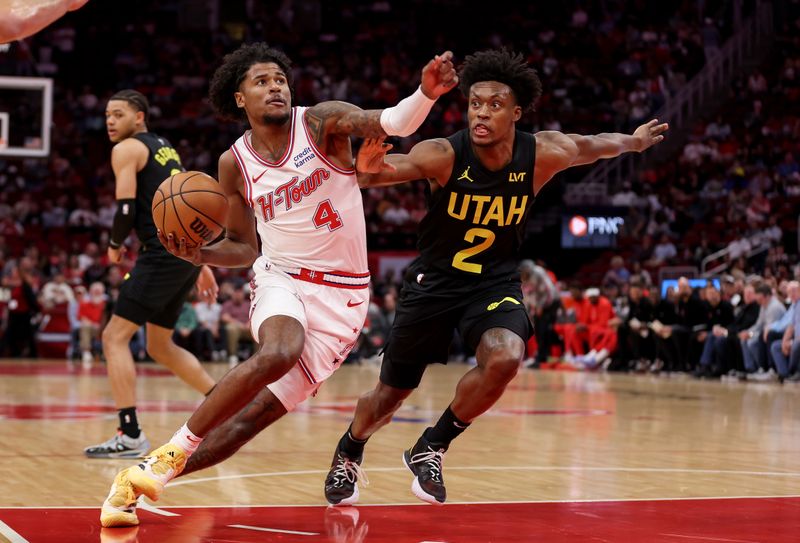 HOUSTON, TEXAS - MARCH 23: Jalen Green #4 of the Houston Rockets drives to the basket while defended by Collin Sexton #2 of the Utah Jazz in the first half at Toyota Center on March 23, 2024 in Houston, Texas.  NOTE TO USER: User expressly acknowledges and agrees that, by downloading and or using this photograph, User is consenting to the terms and conditions of the Getty Images License Agreement. (Photo by Tim Warner/Getty Images)