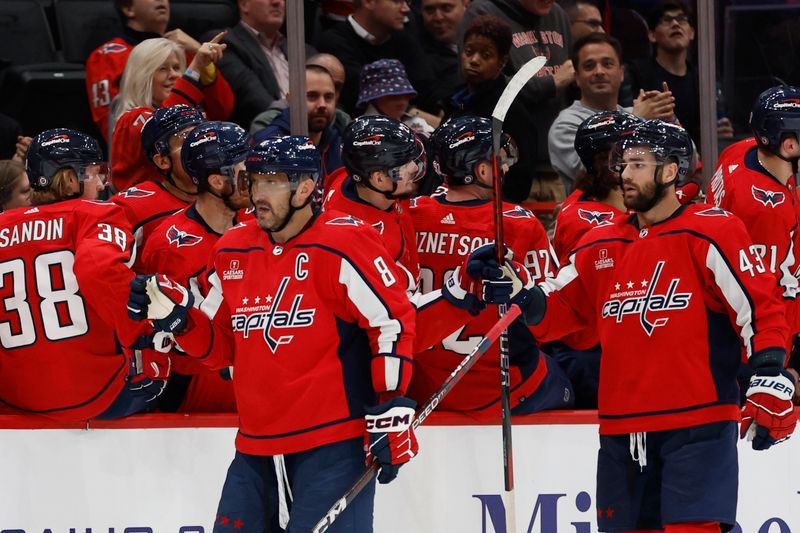 Oct 24, 2023; Washington, District of Columbia, USA; Washington Capitals left wing Alex Ovechkin (8) celebrates with teammates after scoring a goal against the Toronto Maple Leafs in the second period at Capital One Arena. Mandatory Credit: Geoff Burke-USA TODAY Sports