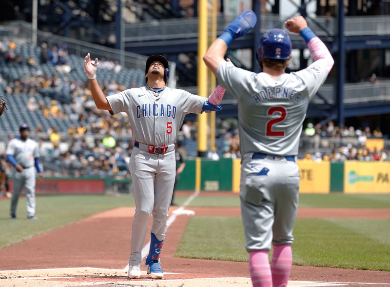 May 12, 2024; Pittsburgh, Pennsylvania, USA;  Chicago Cubs third baseman Christopher Morel (5) reacts as he crosses home plate on a two run home run against the Pittsburgh Pirates during the first inning at PNC Park. Mandatory Credit: Charles LeClaire-USA TODAY Sports