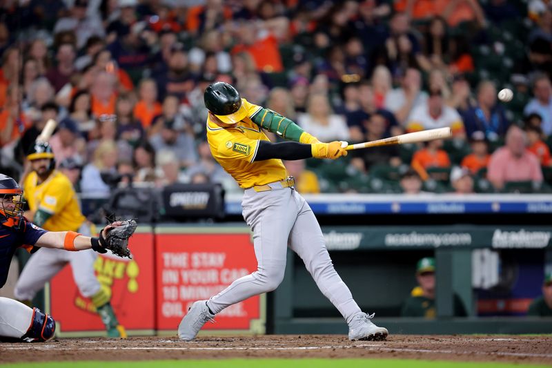 Jul 27, 2025; Houston, Texas, USA;  Athletics catcher Austin Wynns (29) hits a single against the Houston Astros during the fourth inning at Daikin Park. Mandatory Credit: Erik Williams-Imagn Images
