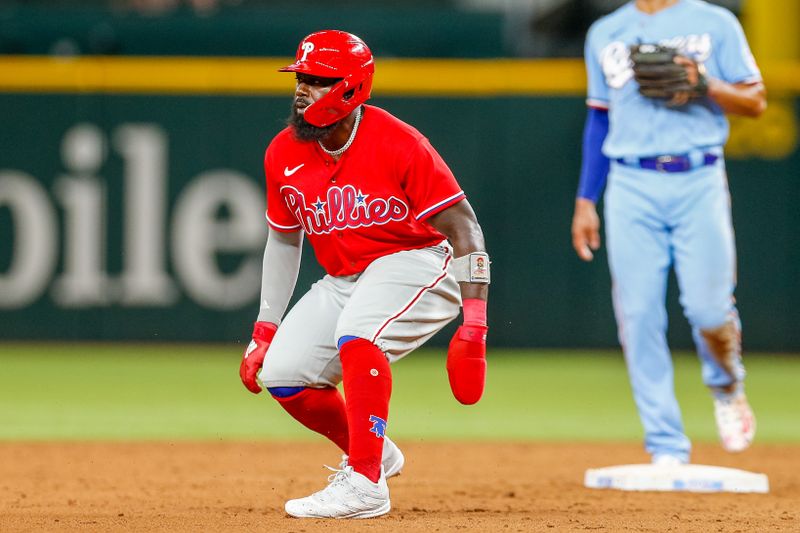 Apr 2, 2023; Arlington, Texas, USA; Philadelphia Phillies left fielder Josh Harrison (2) rounds second base during the sixth inning against the Texas Rangers at Globe Life Field. Mandatory Credit: Andrew Dieb-USA TODAY Sports