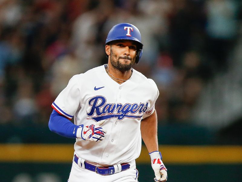 Aug 2, 2023; Arlington, Texas, USA; Texas Rangers second baseman Marcus Semien (2) hits a two-run homerun during the sixth inning against the Chicago White Sox at Globe Life Field. Mandatory Credit: Andrew Dieb-USA TODAY Sports