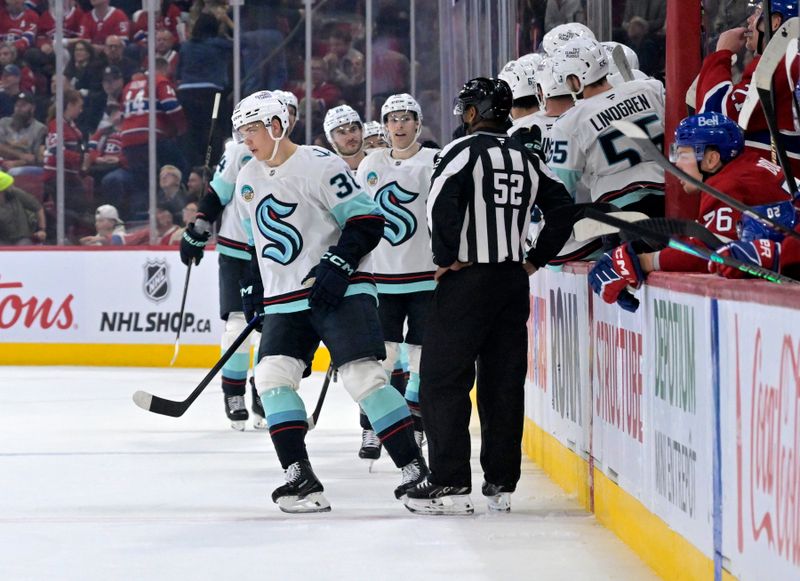 Oct 14, 2025; Montreal, Quebec, CAN; Seattle Kraken forward Jani Nyman (38) celebrates with teammates after scoring a goal against the Montreal Canadiens during the second period at the Bell Centre. Mandatory Credit: Eric Bolte-Imagn Images