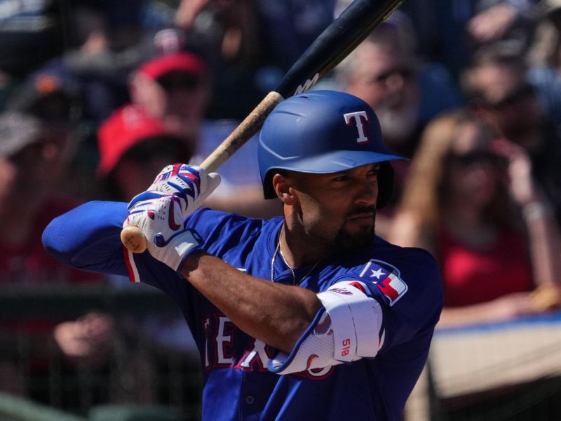 Mar 4, 2024; Surprise, Arizona, USA; Texas Rangers second baseman Marcus Semien (2) bats against the Los Angeles Angels during the third inning at Surprise Stadium. Mandatory Credit: Joe Camporeale-USA TODAY Sports