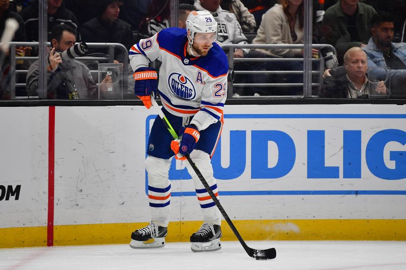 Dec 30, 2023; Los Angeles, California, USA; Edmonton Oilers center Leon Draisaitl (29) controls the puck against the Los Angeles Kings during the second period at Crypto.com Arena. Mandatory Credit: Gary A. Vasquez-USA TODAY Sports