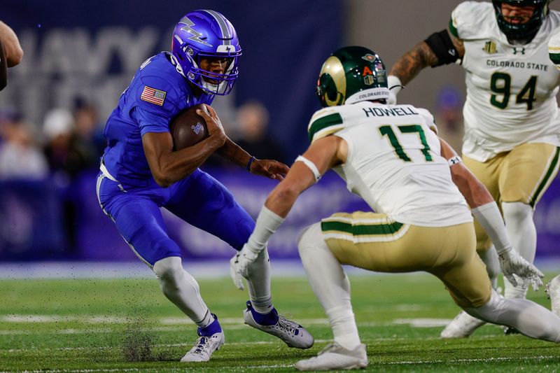 Oct 19, 2024; Colorado Springs, Colorado, USA; Air Force Falcons quarterback Josh Johnson (11) runs the ball as Colorado State Rams defensive back Jack Howell (17) defends in the first quarter at Falcon Stadium. Mandatory Credit: Isaiah J. Downing-Imagn Images