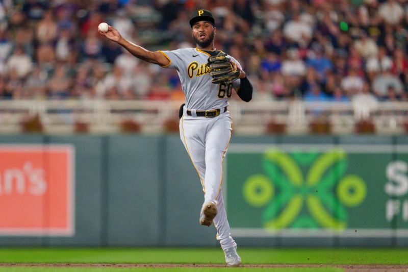 Aug 18, 2023; Minneapolis, Minnesota, USA; Pittsburgh Pirates second baseman Liover Peguero (60) throws to first, retiring Minnesota Twins right fielder Max Kepler (26) in the bottom of the fifth inning at Target Field. Mandatory Credit: Matt Blewett-USA TODAY Sports