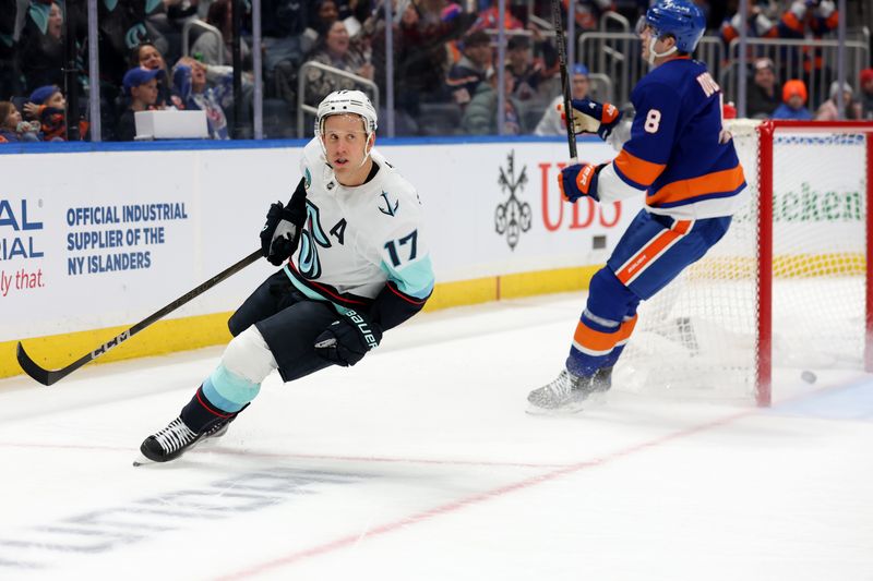 Dec 5, 2024; Elmont, New York, USA; Seattle Kraken center Jaden Schwartz (17) reacts after scoring an empty net goal against New York Islanders defenseman Noah Dobson (8) during the third period at UBS Arena. Mandatory Credit: Brad Penner-Imagn Images