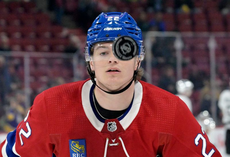 Dec 7, 2023; Montreal, Quebec, CAN; Montreal Canadiens forward Cole Caufield (22) keeps his eyes on the puck during the warmup period before the game against the Los Angeles Kings at the Bell Centre. Mandatory Credit: Eric Bolte-USA TODAY Sports