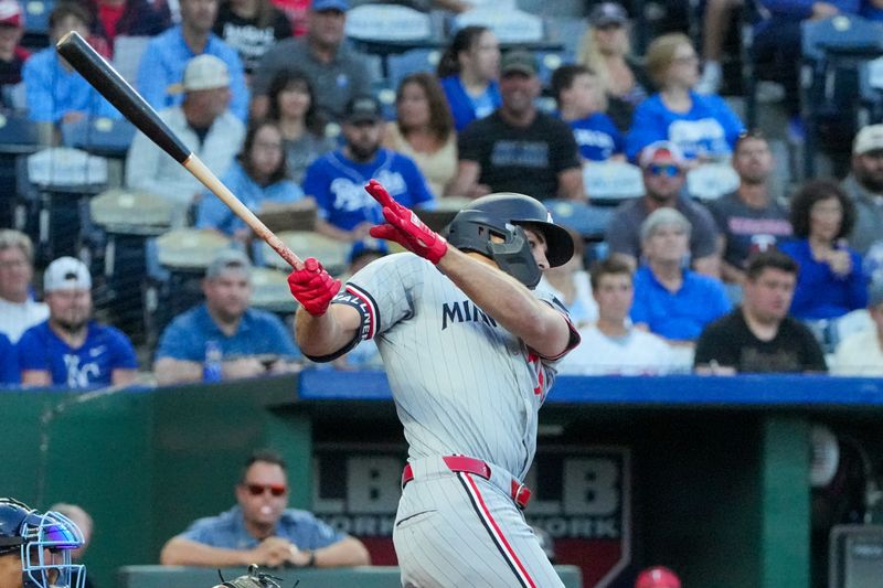 Sep 6, 2024; Kansas City, Missouri, USA; Minnesota Twins right fielder Matt Wallner (38) hits a single against the Kansas City Royals in the first inning at Kauffman Stadium. Mandatory Credit: Denny Medley-Imagn Images