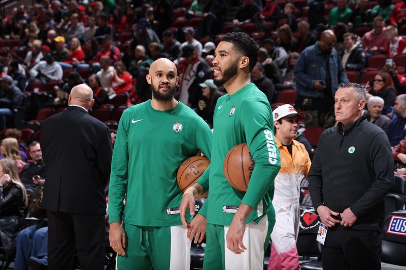 CHICAGO, IL - MARCH 23: Derrick White #9 of the Boston Celtics and Jayson Tatum #0 of the Boston Celtics speak before the game against the Chicago Bulls on March 23, 2024 at United Center in Chicago, Illinois. NOTE TO USER: User expressly acknowledges and agrees that, by downloading and or using this photograph, User is consenting to the terms and conditions of the Getty Images License Agreement. Mandatory Copyright Notice: Copyright 2024 NBAE (Photo by Jeff Haynes/NBAE via Getty Images)