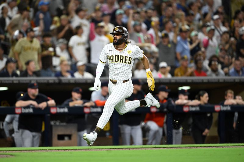 Sep 4, 2024; San Diego, California, USA; San Diego Padres right fielder Fernando Tatis Jr. (23) runs as he scores during the fifth inning against the Detroit Tigers at Petco Park. Mandatory Credit: Denis Poroy-Imagn Images