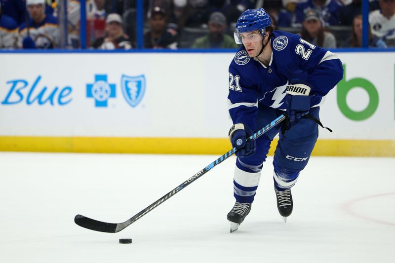 Feb 29, 2024; Tampa, Florida, USA;  Tampa Bay Lightning center Brayden Point (21) controls the puck against the Buffalo Sabres in the first period at Amalie Arena. Mandatory Credit: Nathan Ray Seebeck-USA TODAY Sports