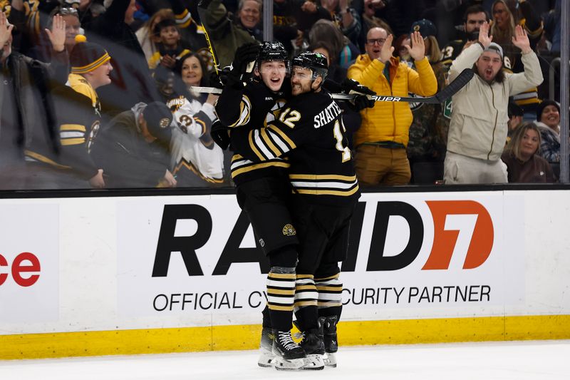 Feb 29, 2024; Boston, Massachusetts, USA; Boston Bruins defenseman Mason Lohrei (6) celebrates his winning goal against the Vegas Golden Knights with defenseman Kevin Shattenkirk (12) during the third period of their 5-4 win at TD Garden. Mandatory Credit: Winslow Townson-USA TODAY Sports