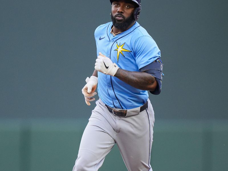 Jun 18, 2024; Minneapolis, Minnesota, USA; Tampa Bay Rays outfielder Randy Arozarena (56) hits home run against the Minnesota Twins in the first inning at Target Field. Mandatory Credit: Brad Rempel-USA TODAY Sports