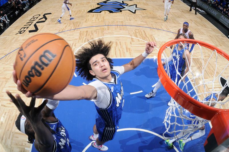 ORLANDO, FL - JANUARY 19: Anthony Black #0 of the Orlando Magic grabs the rebound during the game against the Philadelphia 76ers on January 19, 2024 at the Kia Center in Orlando, Florida. NOTE TO USER: User expressly acknowledges and agrees that, by downloading and or using this photograph, User is consenting to the terms and conditions of the Getty Images License Agreement. Mandatory Copyright Notice: Copyright 2024 NBAE (Photo by Fernando Medina/NBAE via Getty Images)