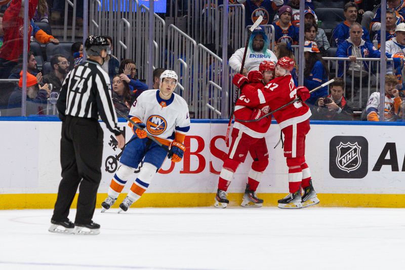 Oct 30, 2023; Elmont, New York, USA; Detroit Red Wings left wing Lucas Raymond (23) celebrates his winning goal against the New York Islanders during overtime at UBS Arena. Mandatory Credit: Thomas Salus-USA TODAY Sports