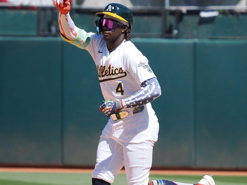 Jul 4, 2024; Oakland, California, USA; Oakland Athletics right fielder Lawrence Butler (4) gestures as he rounds the bases on a solo home run against the Los Angeles Angels during the eighth inning at Oakland-Alameda County Coliseum. Mandatory Credit: Kelley L Cox-USA TODAY Sports