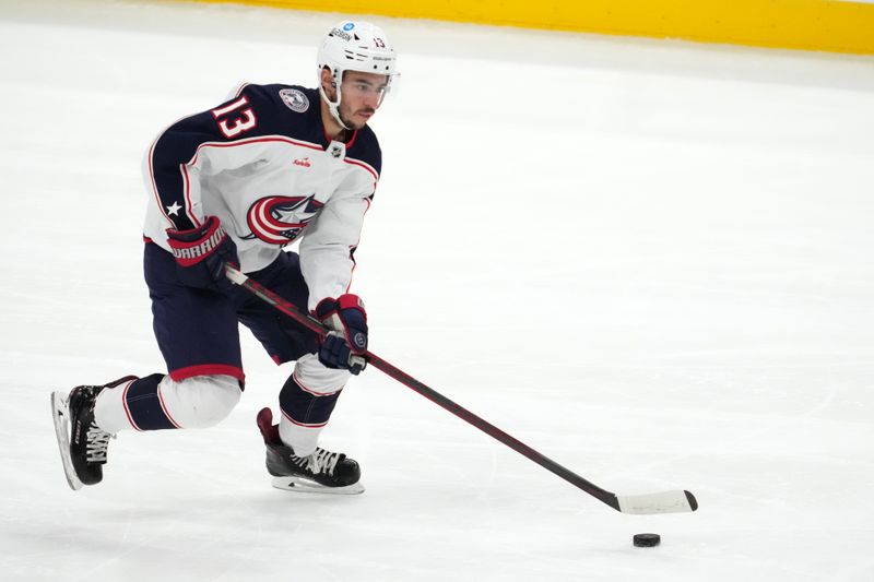 Dec 13, 2022; Sunrise, Florida, USA; Columbus Blue Jackets left wing Johnny Gaudreau (13) skates with the puck against the Florida Panthers during the third period at FLA Live Arena. Mandatory Credit: Jasen Vinlove-USA TODAY Sports