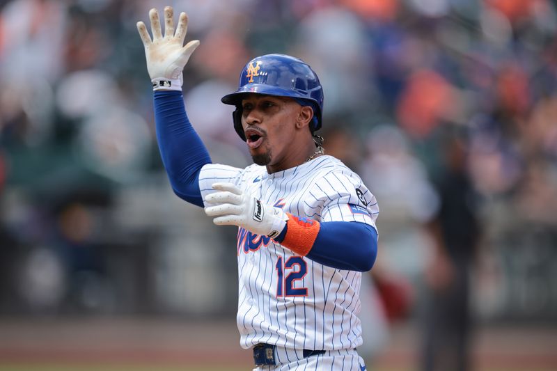 Aug 18, 2024; New York City, New York, USA; New York Mets shortstop Francisco Lindor (12) reacts after hitting an RBI single during the fifth inning against the Miami Marlins at Citi Field. Mandatory Credit: Vincent Carchietta-USA TODAY Sports