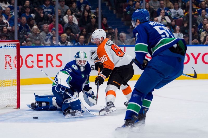 Dec 28, 2023; Vancouver, British Columbia, CAN; Vancouver Canucks defenseman Tyler Myers (57) watches as Philadelphia Flyers forward Joel Farabee (86) scores on goalie Casey DeSmith (29) in the second period at Rogers Arena. Mandatory Credit: Bob Frid-USA TODAY Sports