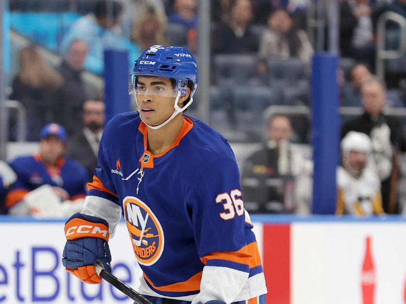 Nov 5, 2024; Elmont, New York, USA; New York Islanders defenseman Isaiah George (36) skates against the Pittsburgh Penguins during the second period at UBS Arena. Mandatory Credit: Brad Penner-Imagn Images