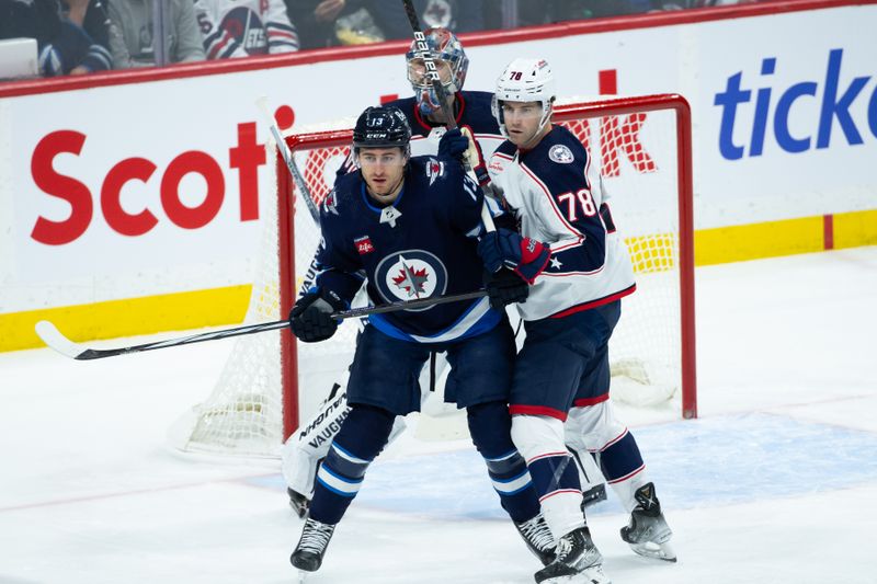 Jan 9, 2024; Winnipeg, Manitoba, CAN; Columbus Blue Jackets defenseman Damon Severson (78) jostles for position with Winnipeg Jets forward Gabriel Vilardi (13) during the third period at Canada Life Centre. Mandatory Credit: Terrence Lee-USA TODAY Sports