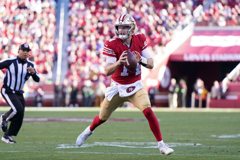 San Francisco 49ers quarterback Sam Darnold (14) looks to pass during an NFL football game against the Los Angeles Rams in Santa Clara, Calif., Sunday, Jan. 7, 2024. (AP Photo/Loren Elliott)